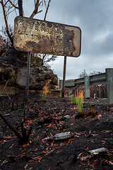 Image showing Burnt road sign, rubbish and landscape after bush fires Australi