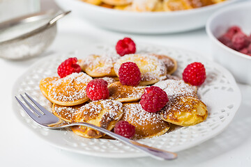 Image showing Poffertjes - small Dutch pancakes with fresh raspberries 