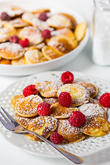 Image showing Poffertjes - small Dutch pancakes with fresh raspberries 