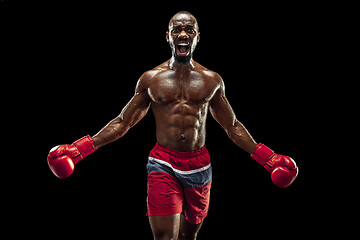 Image showing Hand of boxer over black background. Strength, attack and motion concept