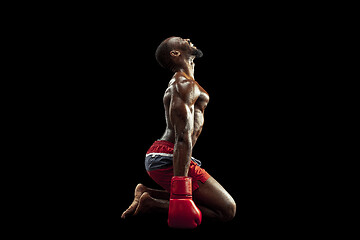 Image showing Hand of boxer over black background. Strength, attack and motion concept