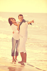 Image showing happy young couple have fun at beautiful beach