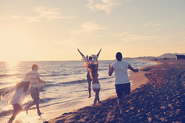 Image showing people group running on the beach