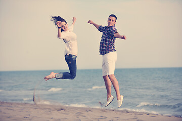 Image showing happy young couple have fun on beach