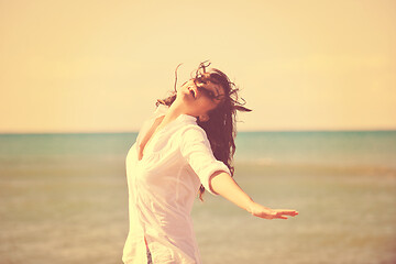 Image showing happy young woman on beach