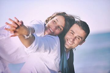 Image showing happy young couple have fun at beautiful beach