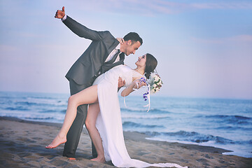 Image showing romantic beach wedding at sunset