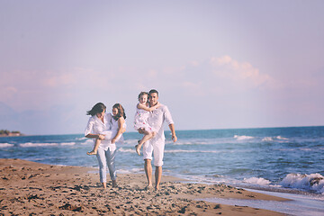 Image showing happy young  family have fun on beach