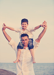 Image showing happy young family have fun on beach