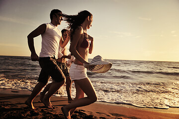 Image showing people group running on the beach