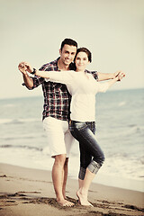 Image showing happy young couple have fun on beach