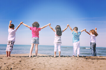 Image showing happy young  people group have fun on beach