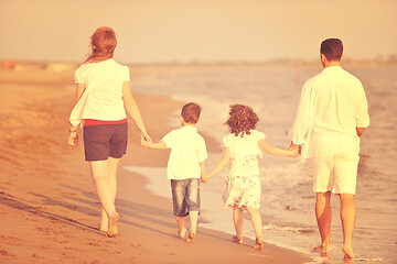 Image showing happy young family have fun on beach