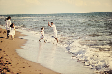 Image showing happy young  family have fun on beach