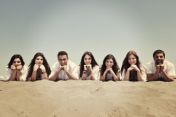 Image showing Group of happy young people in have fun at beach