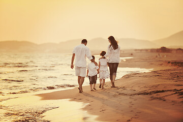 Image showing happy young family have fun on beach at sunset