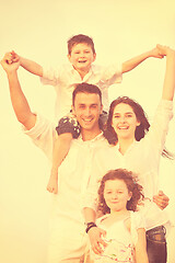 Image showing happy young family have fun on beach