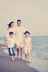 Image showing happy young family have fun on beach