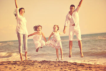 Image showing happy young  family have fun on beach