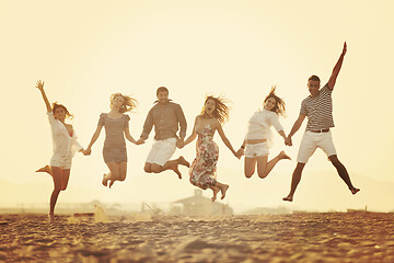 Image showing happy young  people group have fun on beach