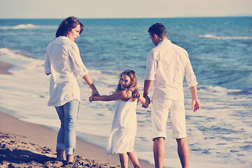 Image showing happy young  family have fun on beach