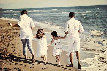 Image showing happy young  family have fun on beach