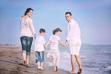 Image showing happy young family have fun on beach