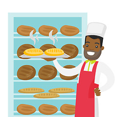 Image showing African-american baker holding tray with bread.