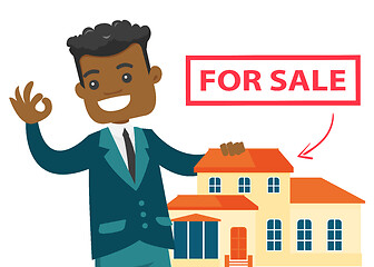 Image showing Young african real estate agent offering the house