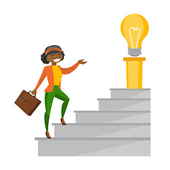 Image showing Business woman walking upstairs to the idea bulb.