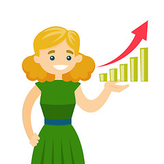 Image showing Young business woman pointing at chart going up.