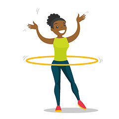 Image showing Young african woman doing exercises with hula hoop