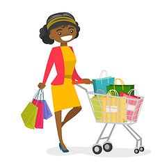 Image showing Young african-american woman with shopping bags.