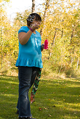 Image showing Child Blowing Bubbles