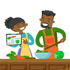 Image showing Couple looking for a recipe in a digital tablet.