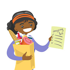 Image showing Woman checking shopping list in the grocery store.