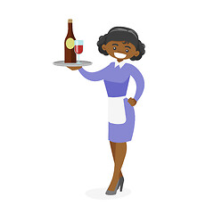 Image showing African-american waitress holding tray with wine.