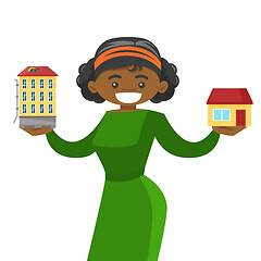 Image showing Woman choosing between town apartment and house.