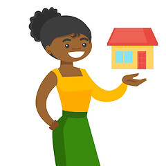 Image showing Young african real estate agent offering the house