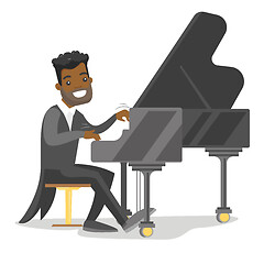 Image showing Young african-american man playing piano.