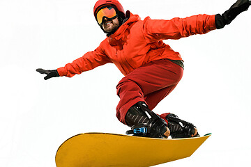 Image showing Portrait of young man in sportswear with snowboard isolated on a white background.