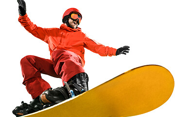 Image showing Portrait of young man in sportswear with snowboard isolated on a white background.