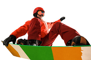 Image showing Portrait of young man in sportswear with snowboard isolated on a white background.