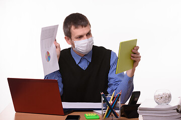 Image showing A man in a medical mask shows a paper document with graphs to a virtual interlocutor