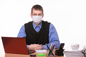 Image showing The office clerk from a medical mask sweats glasses