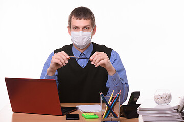 Image showing Office worker in protective medical mask on a white background