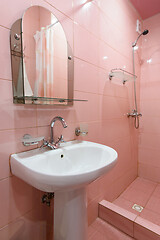 Image showing Compact bathtub interior with shower and washbasin