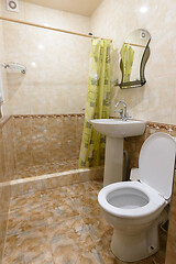 Image showing Interior of a small bathroom combined with a bathroom in a guest house