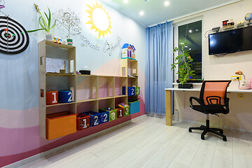 Image showing Interior of a teenage children\'s room with shelves on the wall