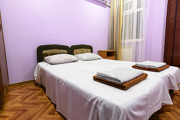 Image showing Interior of a hotel room with a large double bed